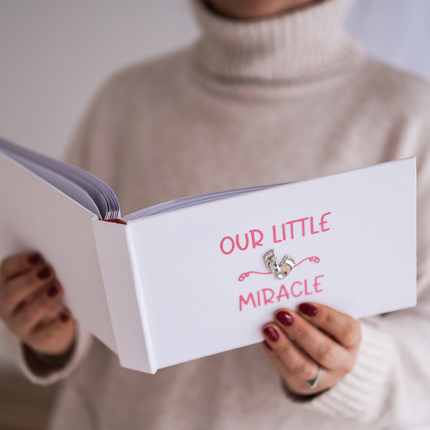 Our little miracle ~ Gorgeous shiny footprint design on a smart white linen album with soft blue/pink printed design