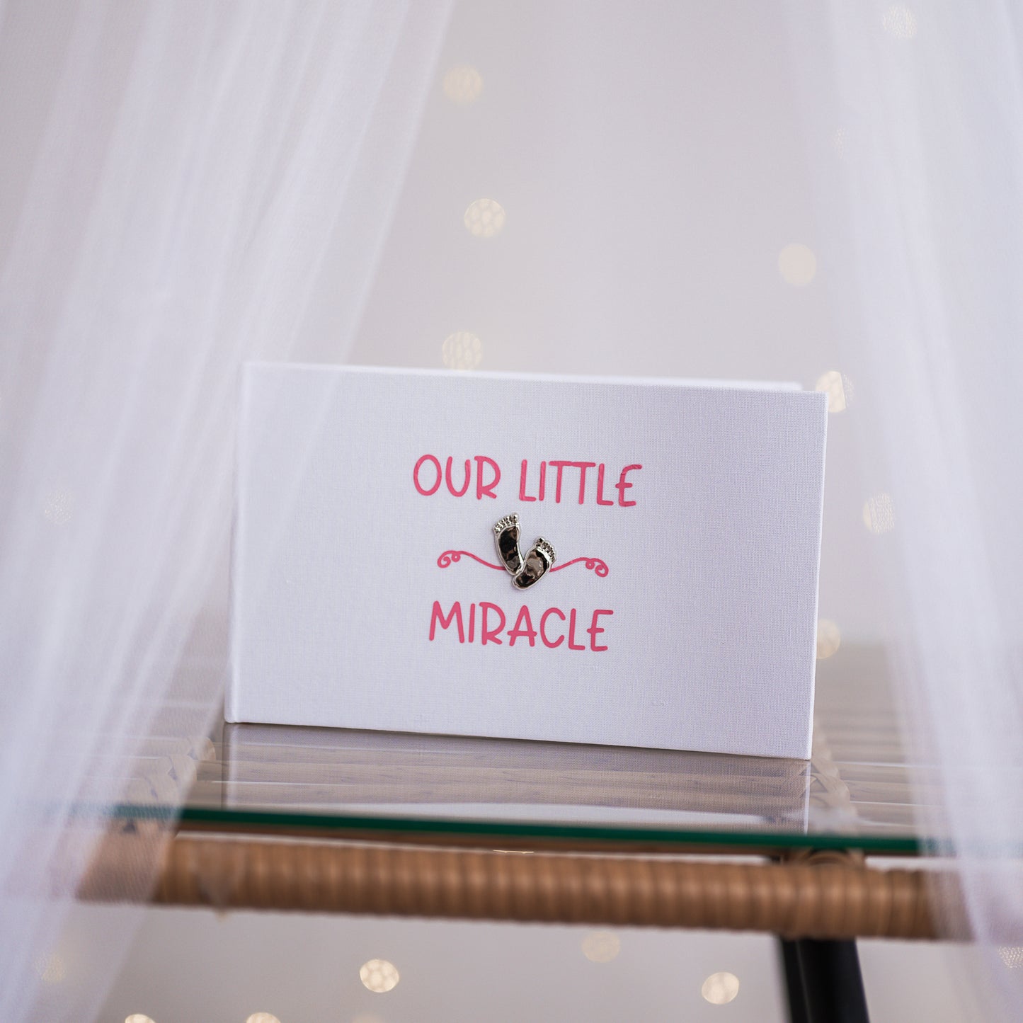 Our little miracle ~ Gorgeous shiny footprint design on a smart white linen album with soft blue/pink printed design