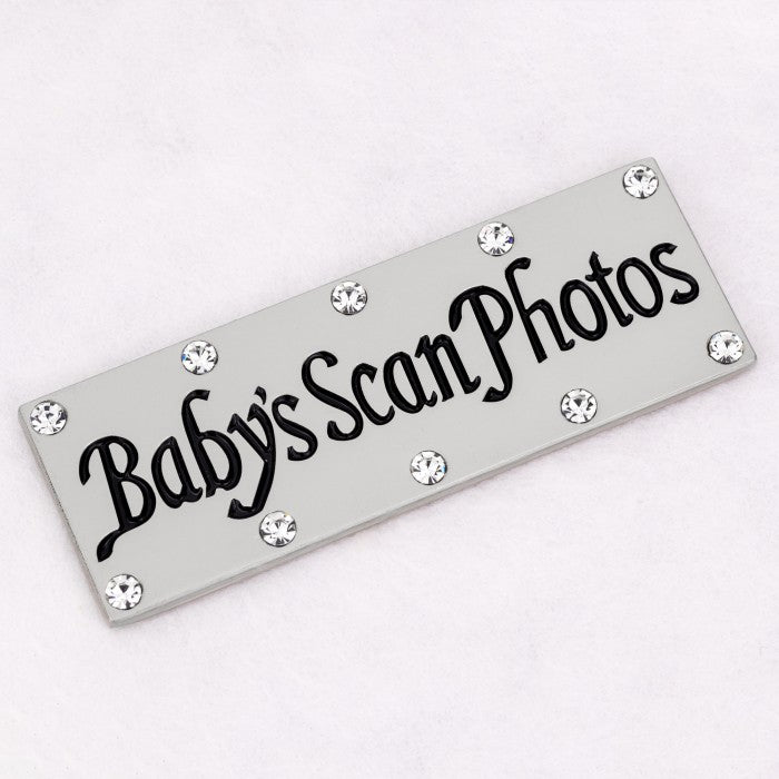 Baby's Scan Photos - White photo album/storage with footprint design