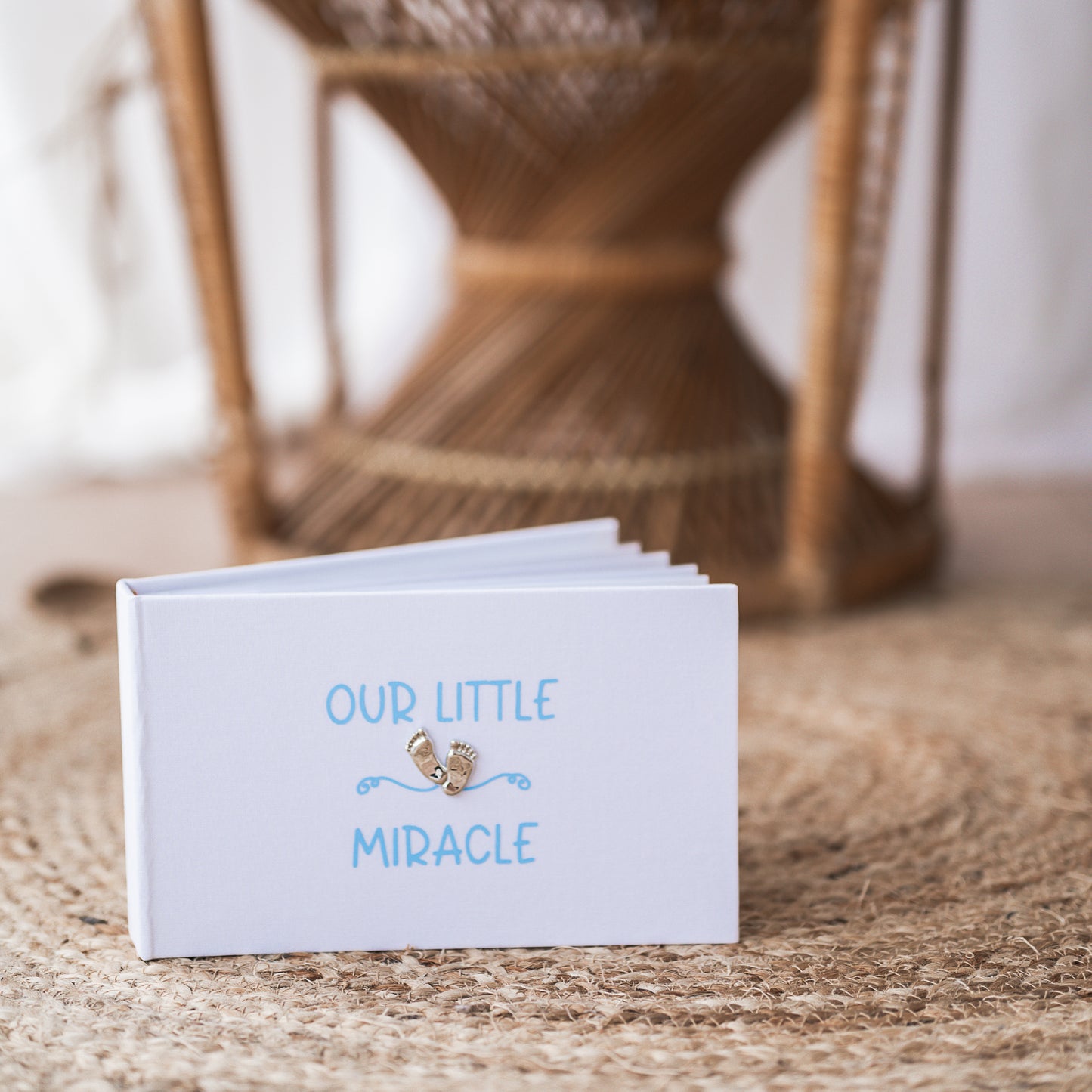 Our little miracle ~ Gorgeous shiny footprint design on a smart white linen album with soft blue/pink printed design