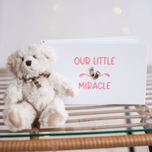 Our little miracle ~ Gorgeous shiny footprint design on a smart white linen album with soft blue/pink printed design