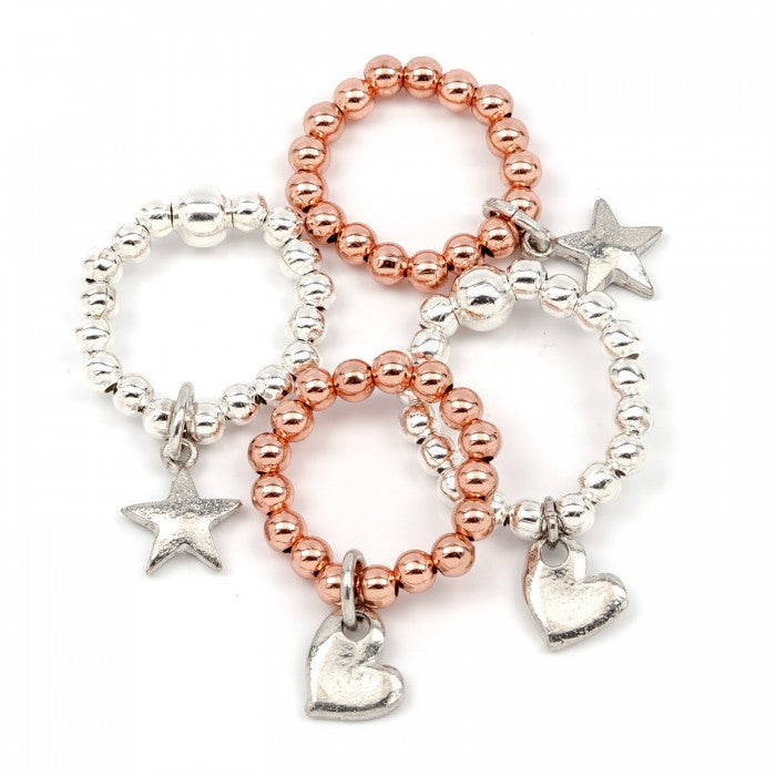 A gorgeous range of stretch bead rings in rose gold/silver plate